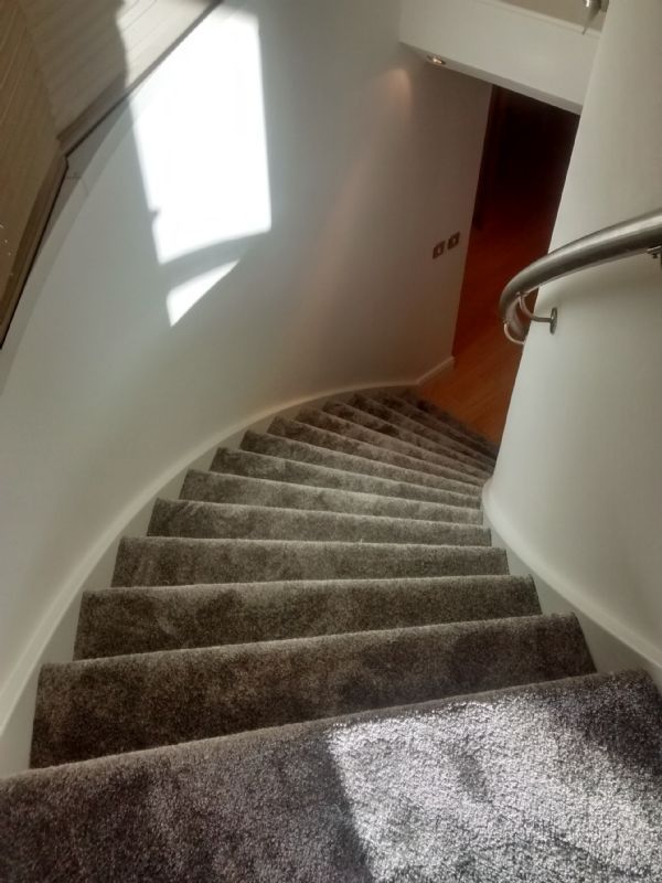 Grey carpet Shaun fitted down a staircase in a Cheltenham home