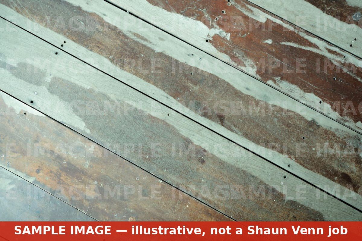 Old floorboards stripped back before sub-floor preparation (watermarked sample image, not a Shaun Venn job)